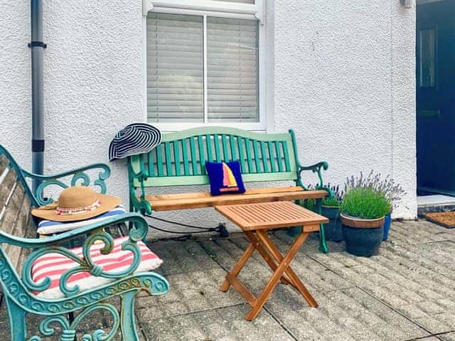Benches to the front of the property. This spot catches the sun well into the evening | Pebble Cottage, Cullercoats, near Tynemouth