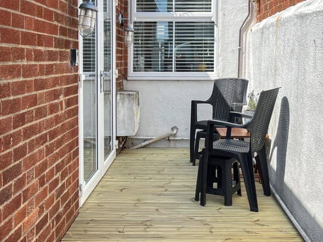 Patio to the rear. This decked area is private space, not overlooked. Open the gate and it´s a<br />minute´s walk to the beach | Pebble Cottage, Cullercoats, near Tynemouth