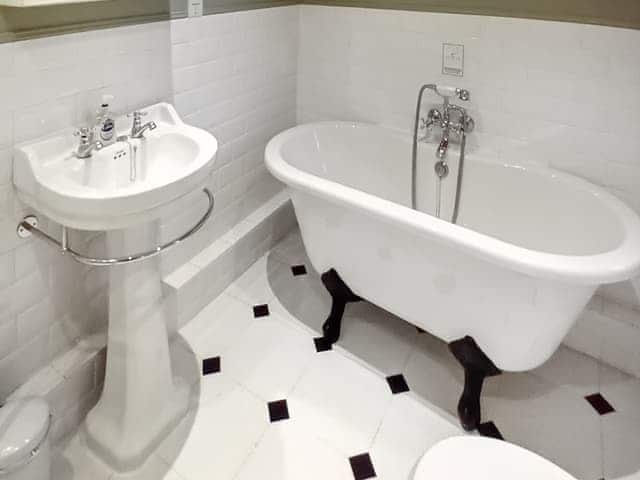 Bathroom with roll-top bath and separate shower cubicle | School Cottage, Newbiggin-in-Bishopdale, near Leyburn