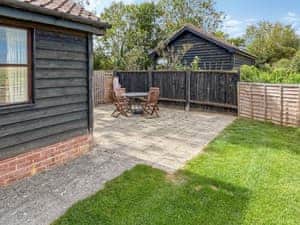 patio area overlooking the fields | Rose Chalet - Framlingham Retreats, Framlingham