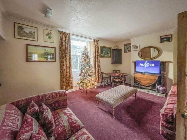 Living room with Christmas decorations | Duvale Priory - Duvale Cottages, Bampton, near Tiverton