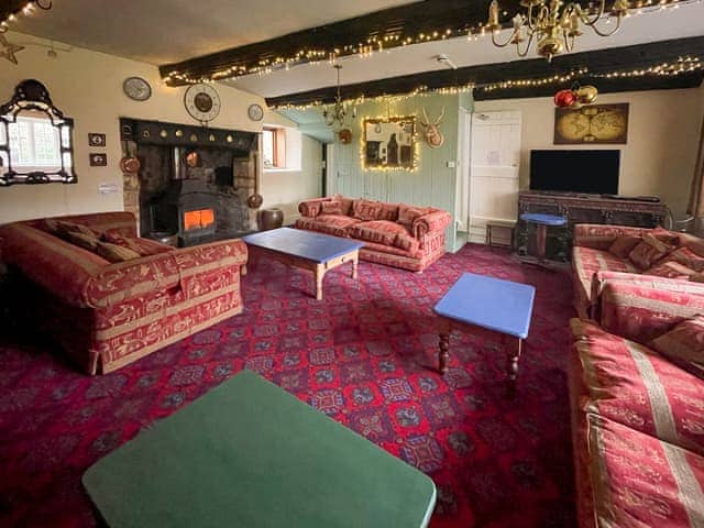 Living room with Christmas decorations | Duvale Priory - Duvale Cottages, Bampton, near Tiverton