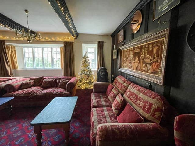 Living room with Christmas decorations | Duvale Priory - Duvale Cottages, Bampton, near Tiverton