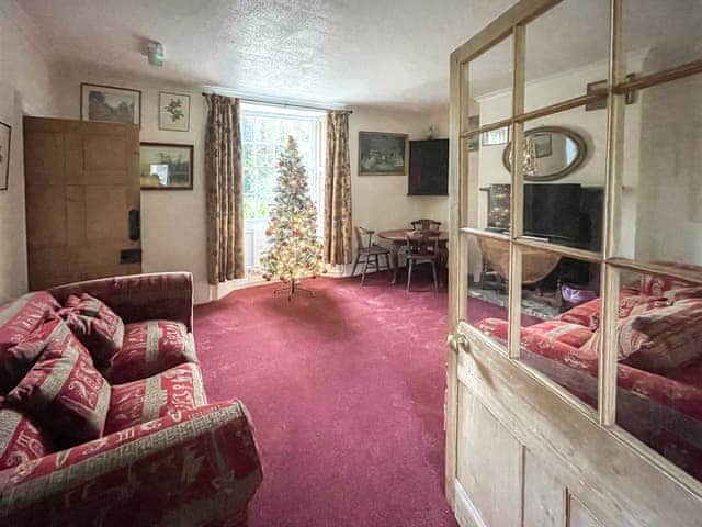 Living room with Christmas decorations | Duvale Priory - Duvale Cottages, Bampton, near Tiverton