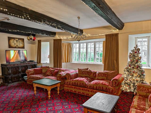 Living room with Christmas decorations | Duvale Priory - Duvale Cottages, Bampton, near Tiverton