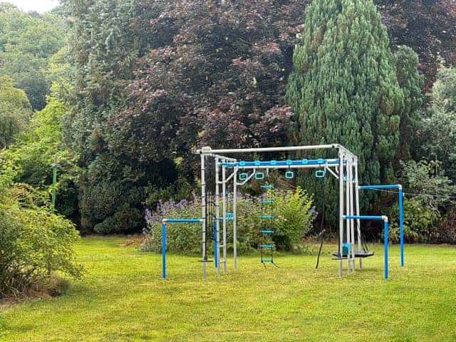 Climbing frame in the garden. Please note children must be supervised at all times | Duvale Priory - Duvale Cottages, Bampton, near Tiverton
