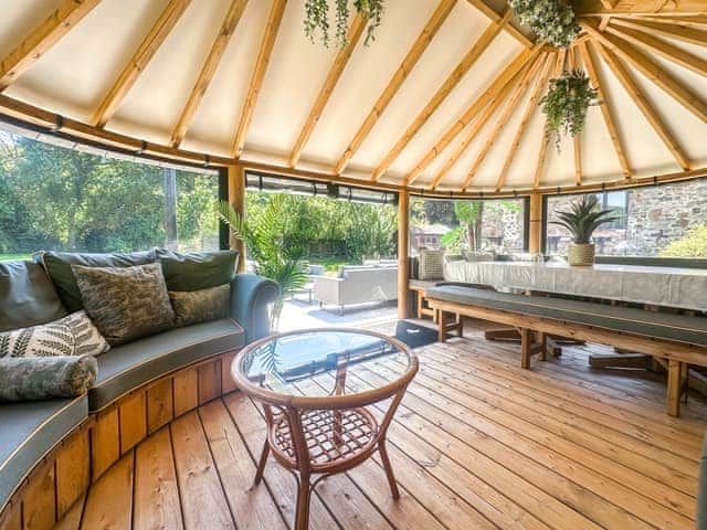 Summer house with patio area just outside also with out door sofas | Orchard Barn - Duvale Cottages, Bampton, near Tiverton