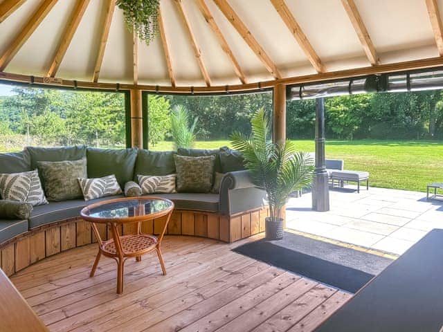 Luxury summer house looking out on to a large garden area | Orchard Barn - Duvale Cottages, Bampton, near Tiverton