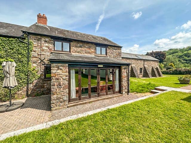 Outdoor area | Duvale Barn - Duvale Cottages, Bampton, near Tiverton
