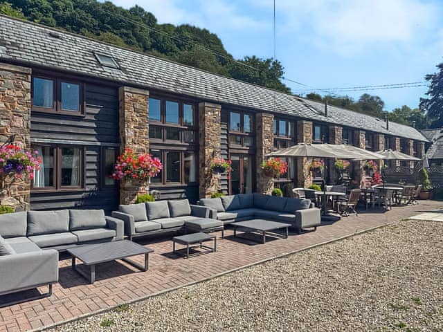 Sitting-out-area | Duvale Barn - Duvale Cottages, Bampton, near Tiverton