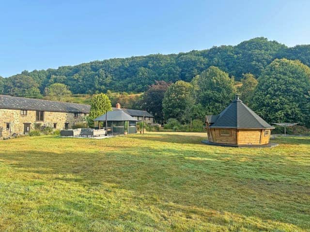 Outside view of Orchard Barn now also with bbq house, terms and conditions apply | Orchard Barn - Duvale Cottages, Bampton, near Tiverton