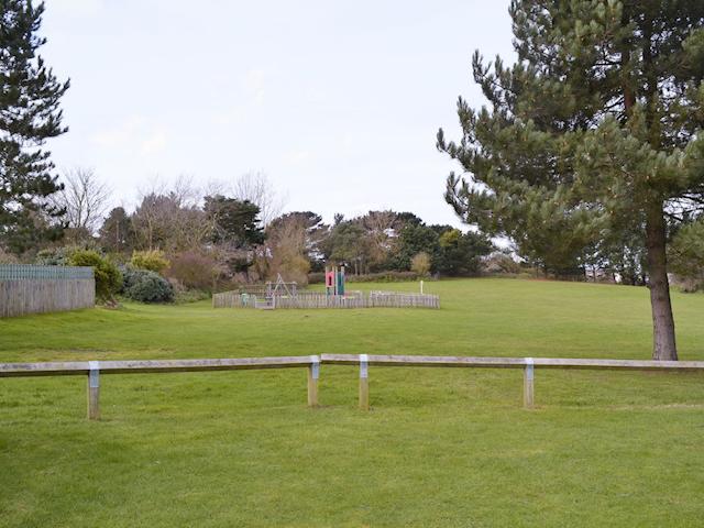 Open grassed area and children&rsquo;s play facility | Seacroft, East Runton, near Cromer