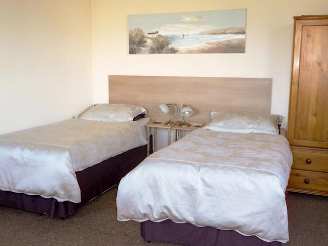 Bedroom set out as twin beds | Scholten Lodge, Pentonvale, near Roche