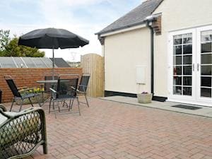 Rear patio/ courtyard | The Snug, Caergeiliog, near Holyhead