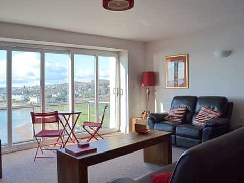 The living area has floor to ceiling windows allowing gueata to take in the breathtaking view | Apartment 6 - Astor House, Torquay