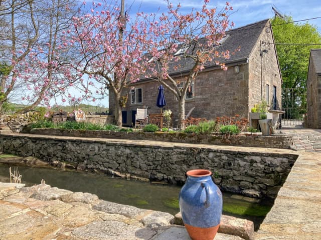 A stone built annexe by the riverside | The Old Mill Annexe, near Hartington