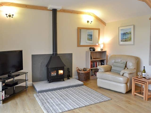 Living room with wood burning stove | Tresidder Barn, Constantine, near Falmouth