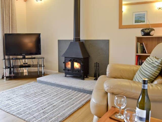 Living room with wood burning stove | Tresidder Barn, Constantine, near Falmouth