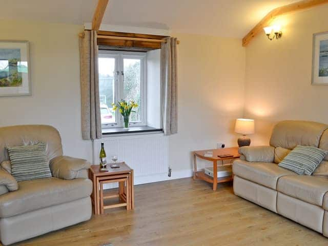 Living room with wood burning stove | Tresidder Barn, Constantine, near Falmouth