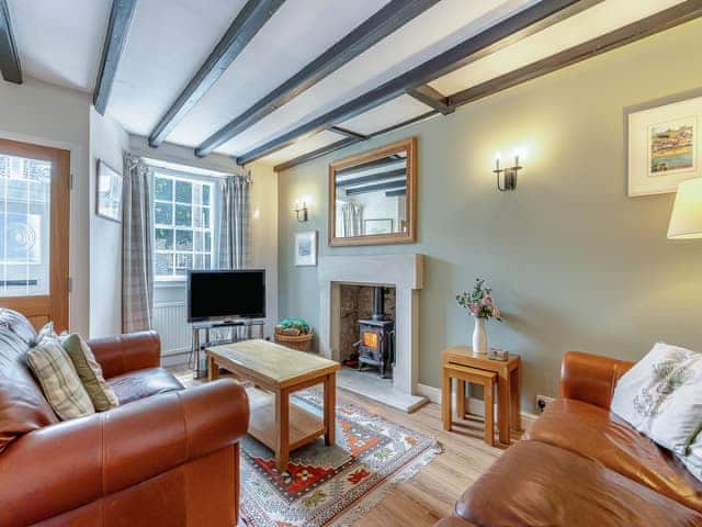 Comfortable beamed living room with multi-fuel burner and adjoining dining area | Four Seasons, Pickering