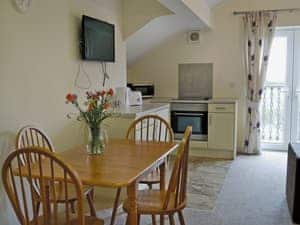 Cosy open plan living/dining room/kitchen with french doors | Birch Lodge - Copper Penny Apartments, Chipshop, near Tavistock