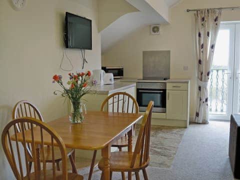 Cosy open plan living/dining room/kitchen with french doors | Birch Lodge - Copper Penny Apartments, Chipshop, near Tavistock