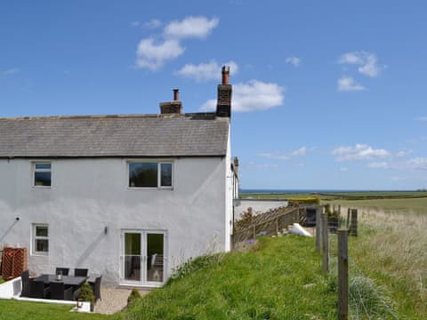 The cottage has far-reaching uniterrupted views both out to sea and far inland across to the Cheviots | Little Haven, East Burton, Bamburgh