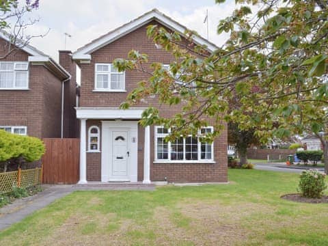 Attractive detached holiday home with lawned garden | Smitten Cottage, Rhyl