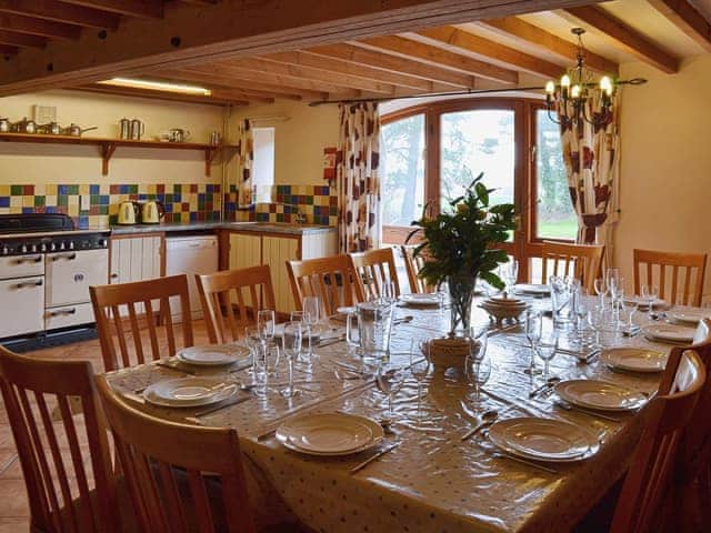 The spacious kitchen diner is tile-floored and has the charm of exposed beams and brickwork | The Granary, Somersal Herbert, Ashbourne