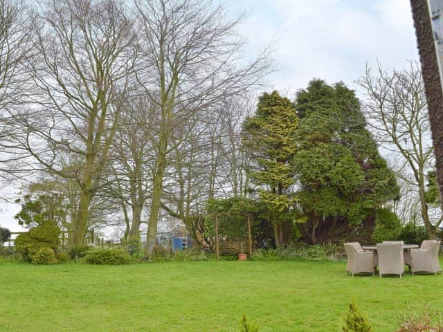 Large, lawned garden with furniture | Glebe Cottage, West Caister, near Great Yarmouth