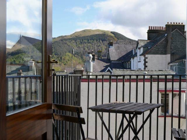 The balcony accessed from the living/dining room has spectacular views of Skiddaw and Latrigg | Fellside - Royal Oak House, Keswick