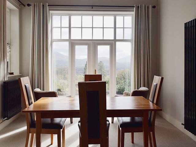 Gaze out at the spectacular views through the French doors whilst dining | 7 Ladstock Hall - Ladstock Hall, Thornthwaite