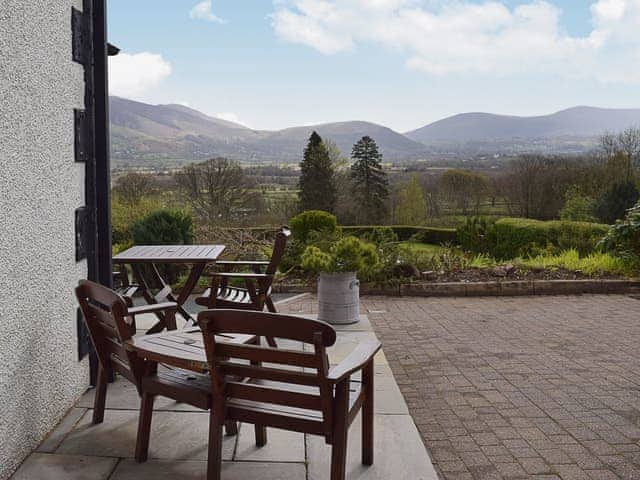 The slated pastio area is slightly raied to take advantage of the wonderful views | 7 Ladstock Hall - Ladstock Hall, Thornthwaite