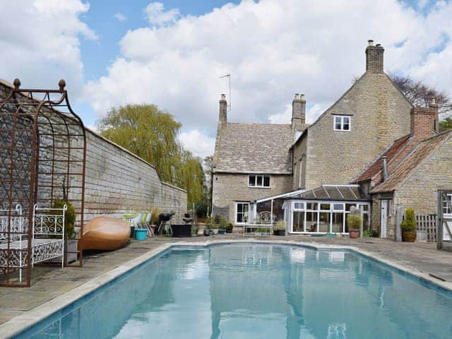 Shared outdoor swimming pool | River Nene Cottages, Water Newton, near Peterborough