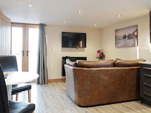 Stylish open-plan living area | Dreamcatcher - Wooldown Holiday Cottages, Marhamchurch, near Bude