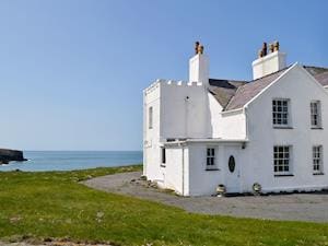Traditional, white washed semi-detached cottage with stunning views | Bwthyn Y Borth, Rhoscolyn, near Holyhead