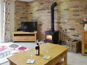 Comfortable living room with woodburner | Dairy Cottage, Pembury, near Tunbridge Wells
