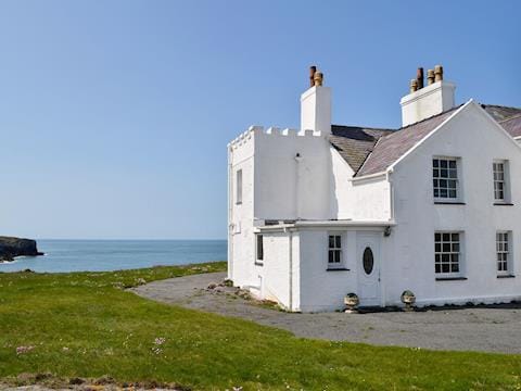 Traditional, white washed semi-detached cottage with stunning views | Bwthyn Y Borth, Rhoscolyn, near Holyhead