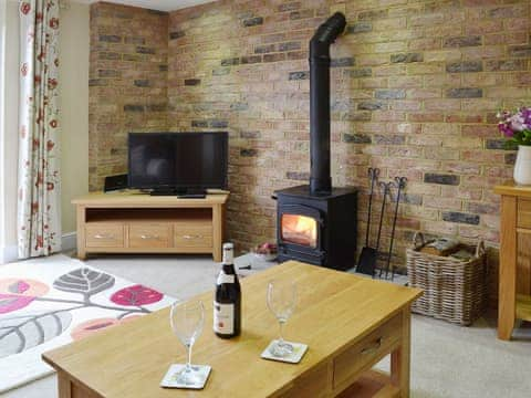 Comfortable living room with woodburner | Dairy Cottage, Pembury, near Tunbridge Wells