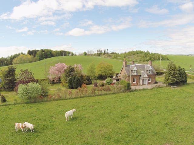 The property nestles beautifully in the surrounding farmland | Strathisla Farm Cottages- Islabank Farmhouse - Strathisla Farm Cottages, Meigle