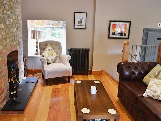 Galleried living area with double sofa bed and wood burner | The Coach House @ The Old Rectory, Buckland St Mary, near Chard