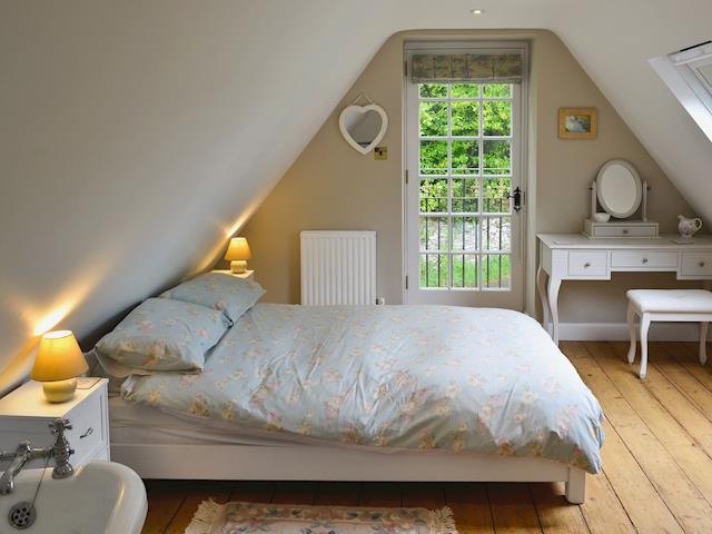 Double bedroom with roll-top bath and en-suite wet room | The Coach House @ The Old Rectory, Buckland St Mary, near Chard