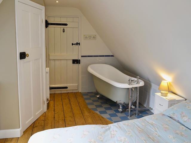 Double bedroom with roll-top bath and en-suite wet room | The Coach House @ The Old Rectory, Buckland St Mary, near Chard