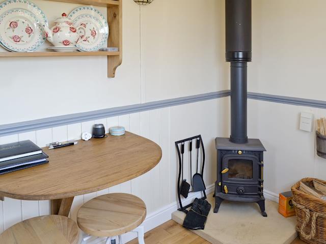 Stylish wood burning stove | The Blue Texel - West Hale Shepherd&rsquo;s Huts, Burton Fleming, near Filey