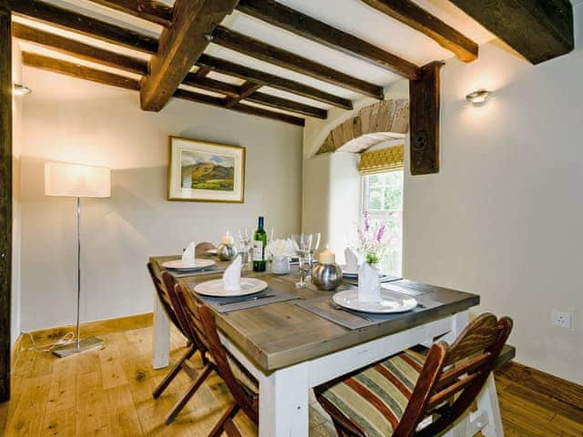 Elegant dining area with views overlooking the river | The Old Mill, Great Strickland near Penrith