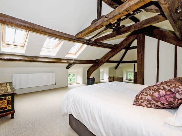 Impressive double bedroom with beams and en-suite with slipper bath | The Old Mill, Great Strickland near Penrith