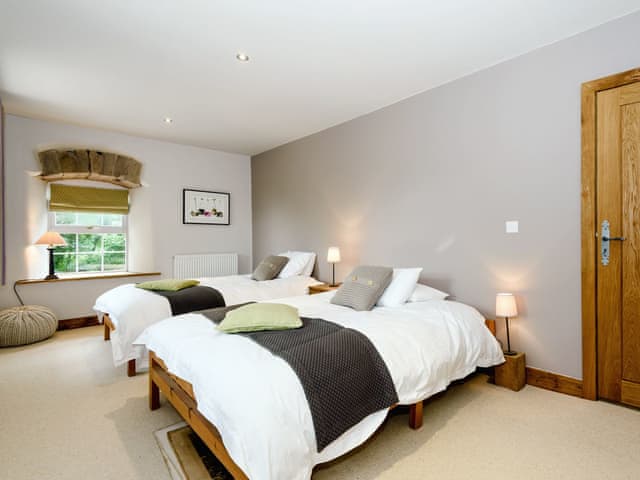 Comfortable bedroom with two double beds | The Old Mill, Great Strickland near Penrith