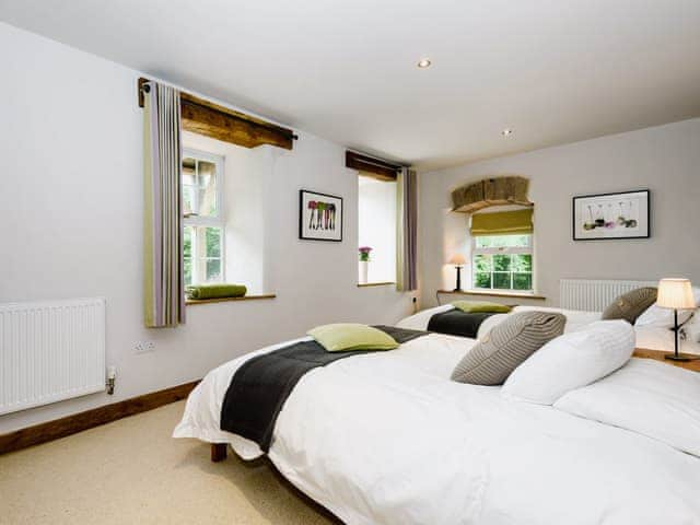 Comfortable bedroom with two double beds | The Old Mill, Great Strickland near Penrith