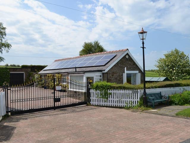 The property is safely located behind electric gates | Etive Cottage, Warenford, near Belford