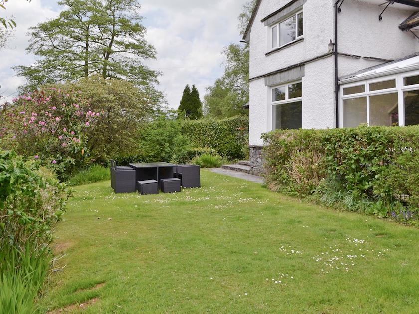 Lawned garden with outdoor furniture | Corner Cottage, Troutbeck Bridge, near Windermere